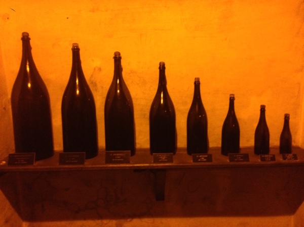 Bottles of various sizes. For reference, the second bottle from the right is a normal-sized bottle of champagne.
