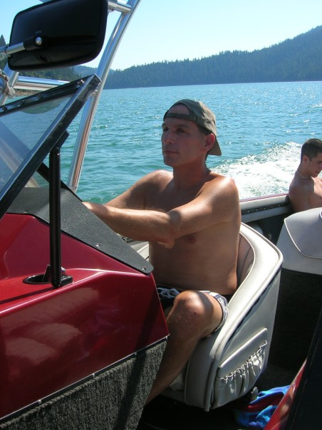 My dad in his element, driving his boat.
