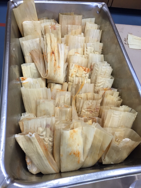 Pan full of assembled (but not yet steamed) tamales.